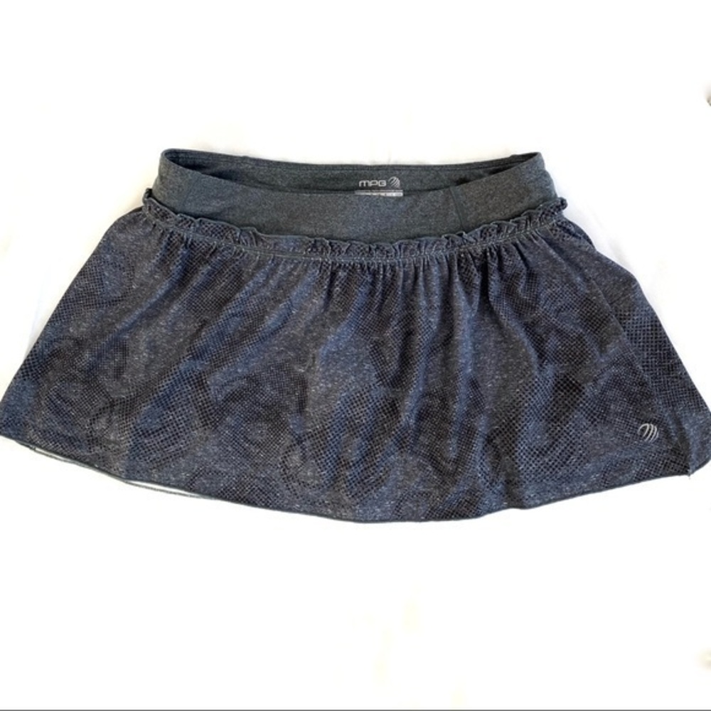MPG athletic skirt with back zipper pocket. Size M